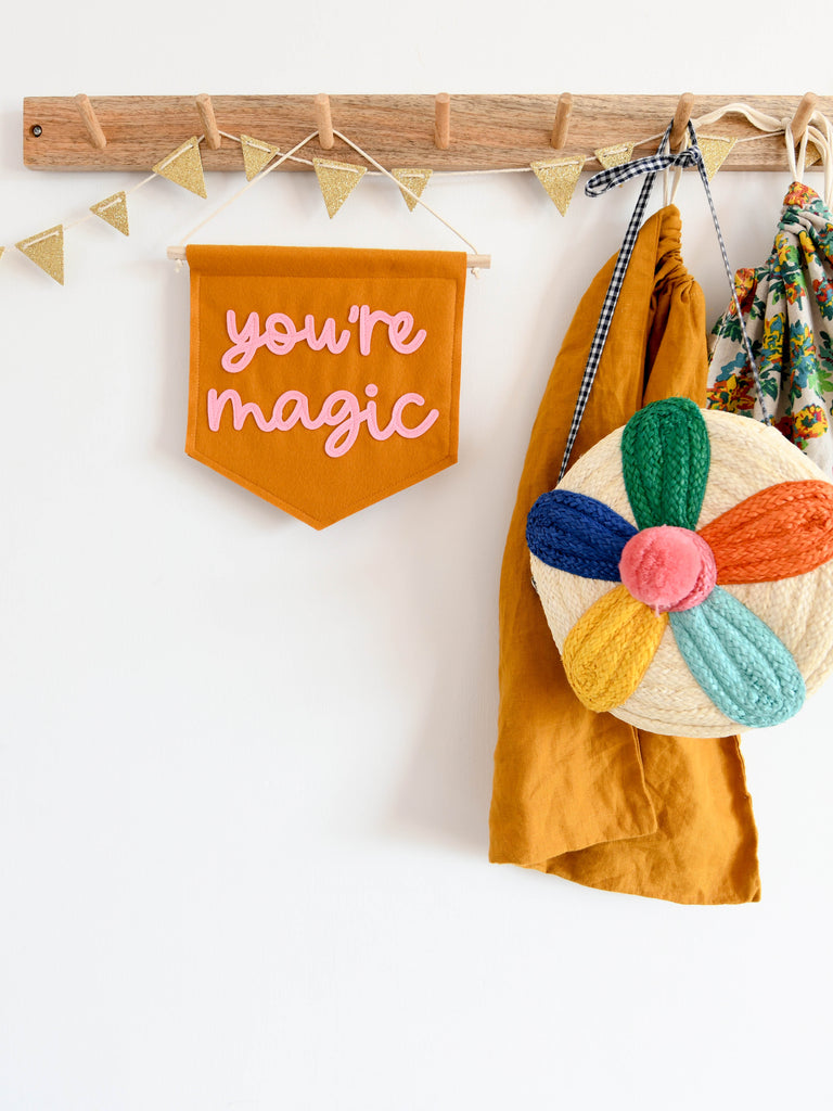 mini felt wall banner with you're magic sewn on  for hanging in nursery and kids rooms.