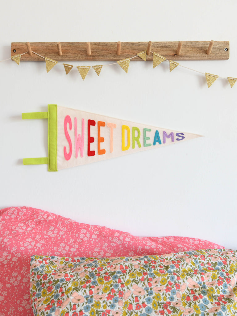 nursery pennant flag saying sweet dreams.