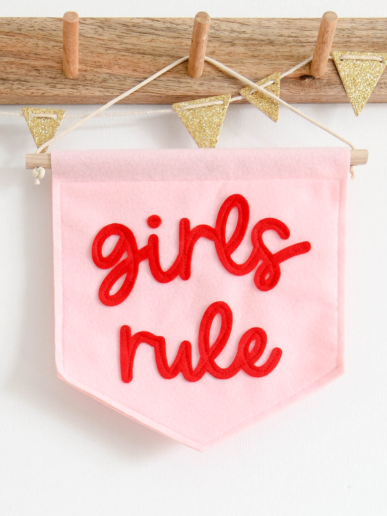 baby pink mini felt banner with girls rule sewn on in red felt for little girls bedroom decor.