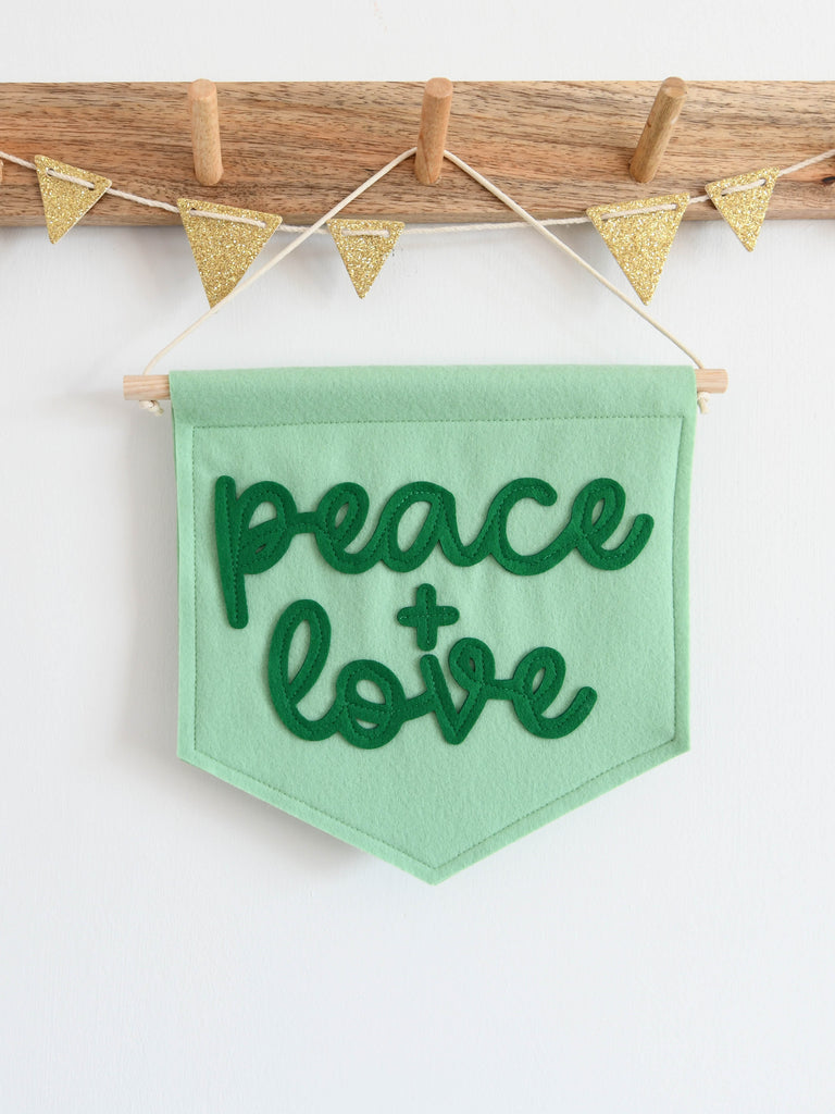 mini felt peace and love banner hung on hook.