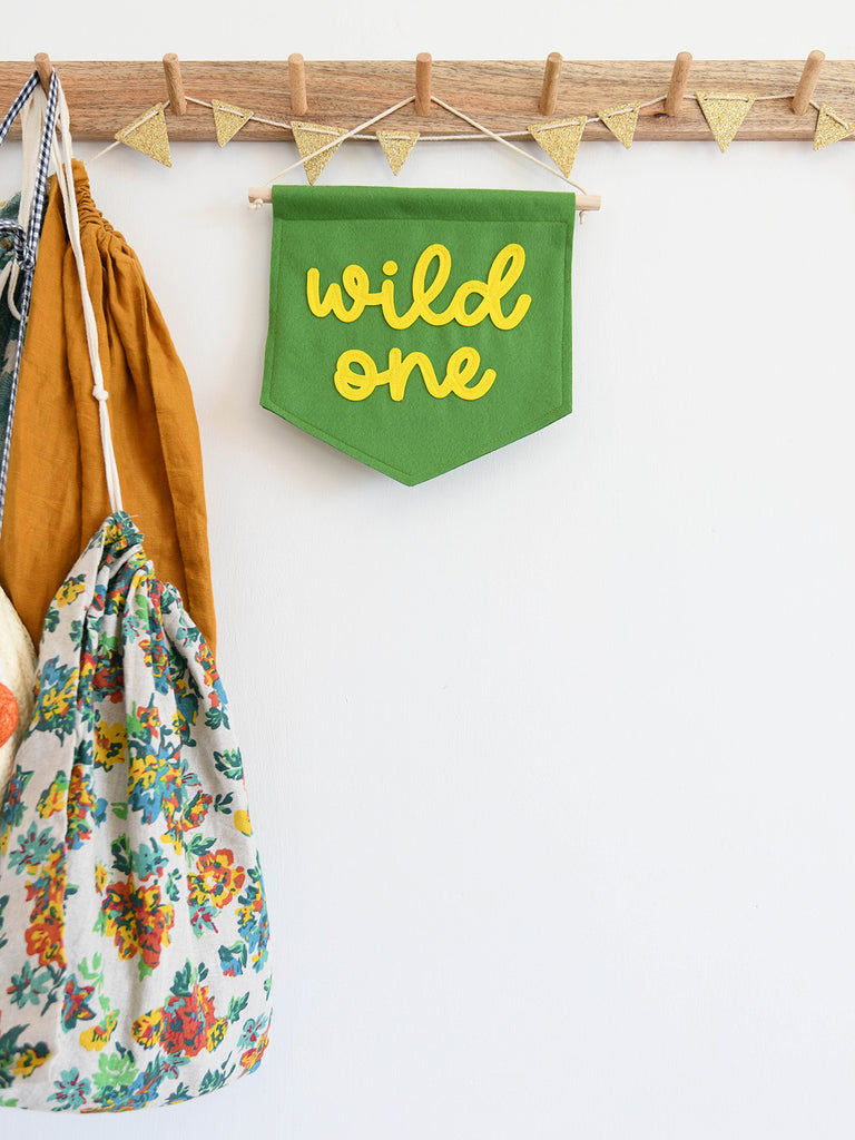 Mini felt wild one banner for jungle themed bed room.